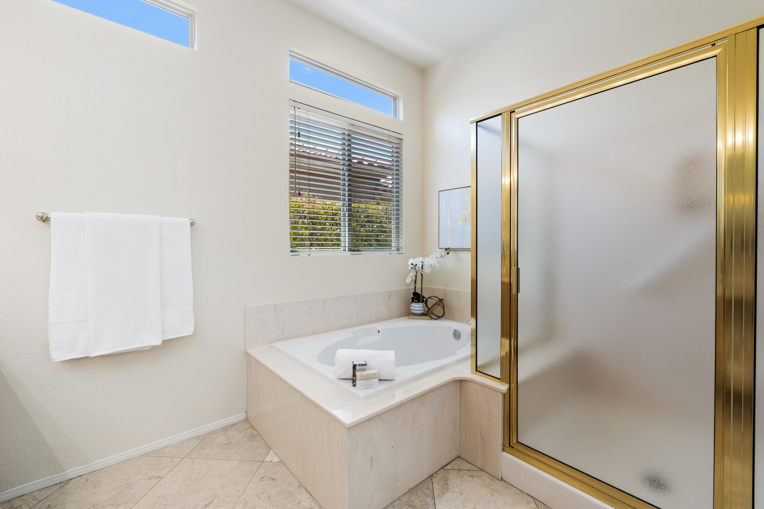 44410 Royal Lytham Drive Indio, CA 92201 - Photo 30 of 72 a bathroom with a sink a mirror and a shower