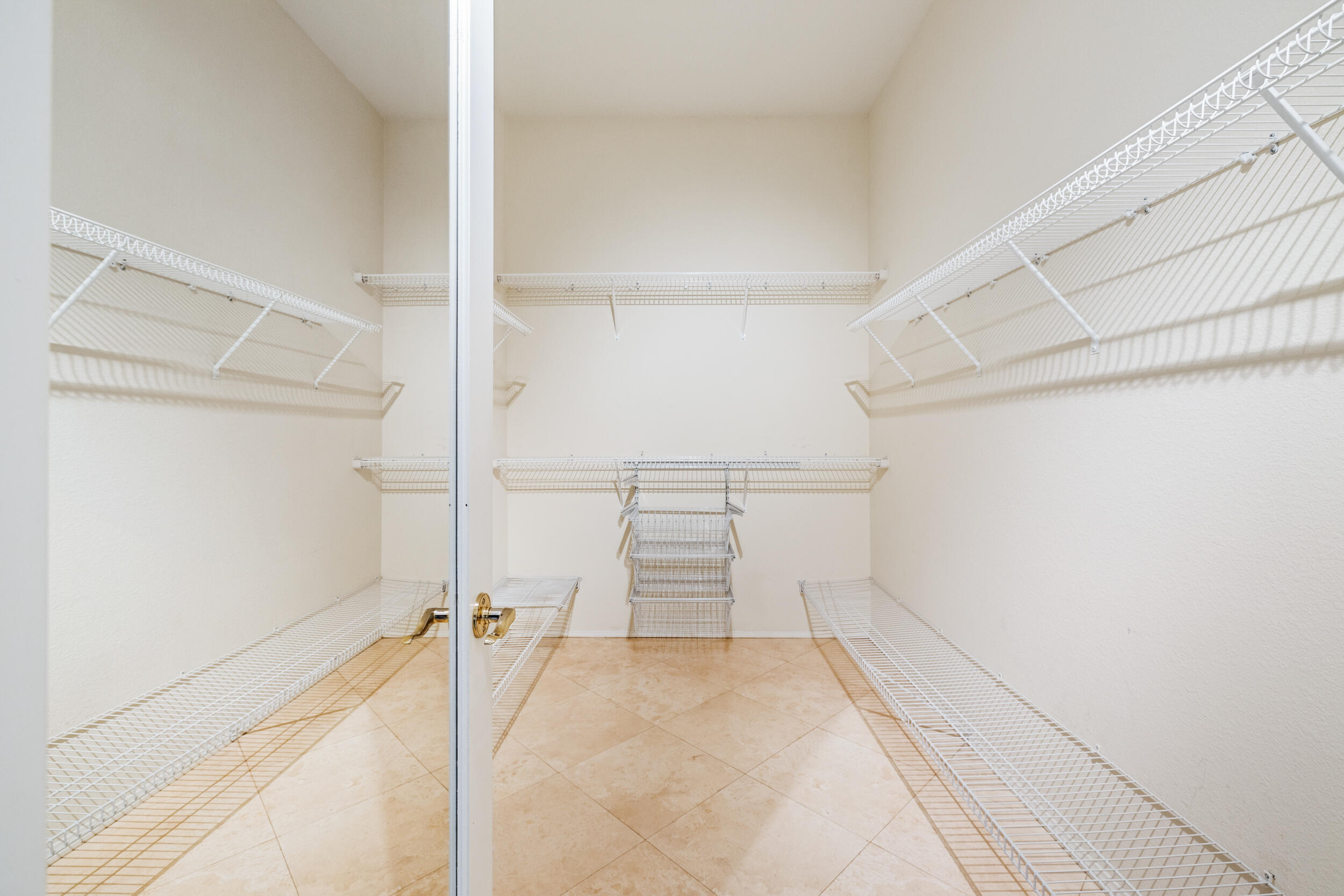 44410 Royal Lytham Drive Indio, CA 92201 - Photo 32 of 72 a view of walk in closet with empty racks