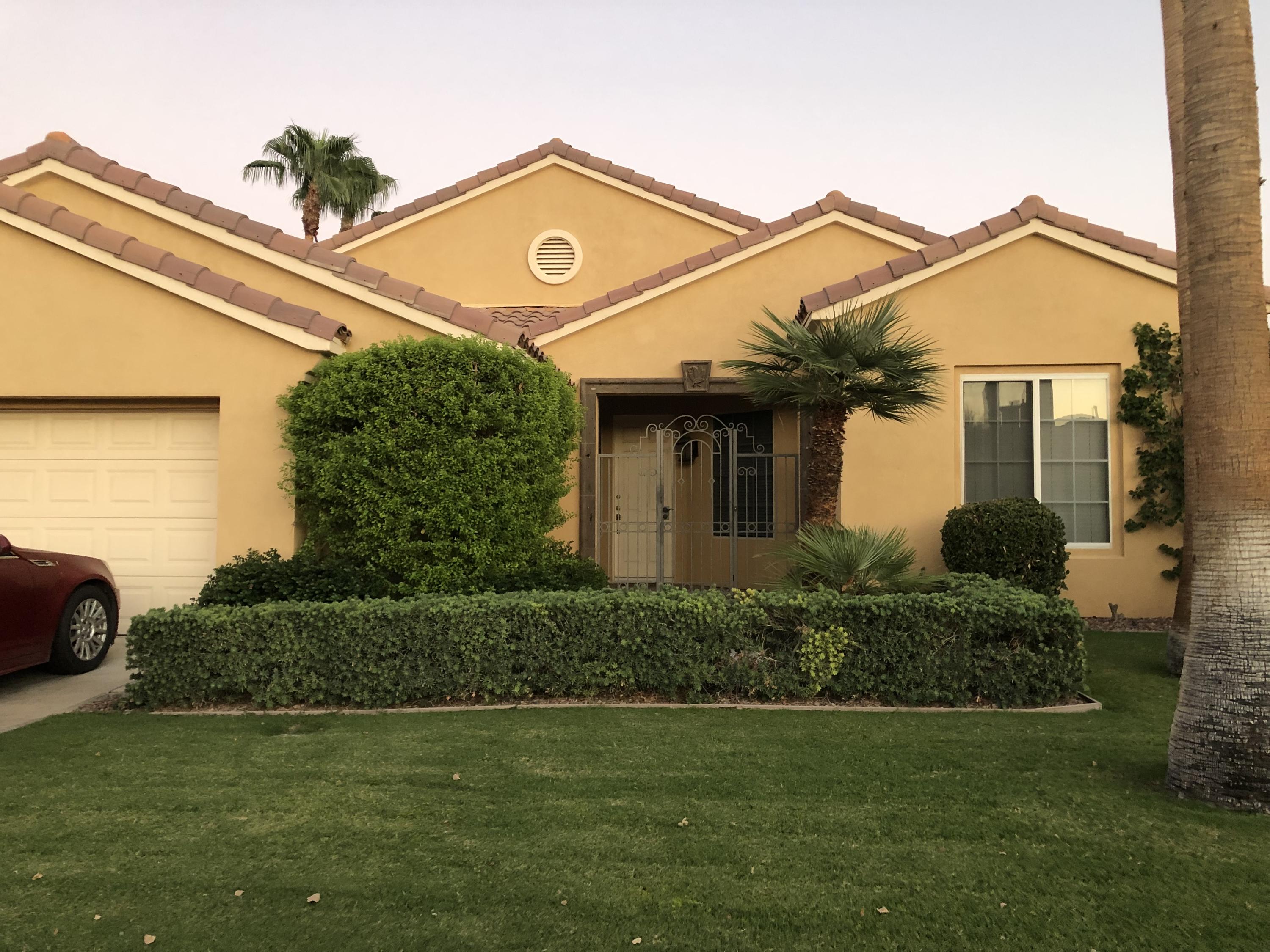 44410 Royal Lytham Drive Indio, CA 92201 - Photo 41 of 72 a front view of a house with a yard