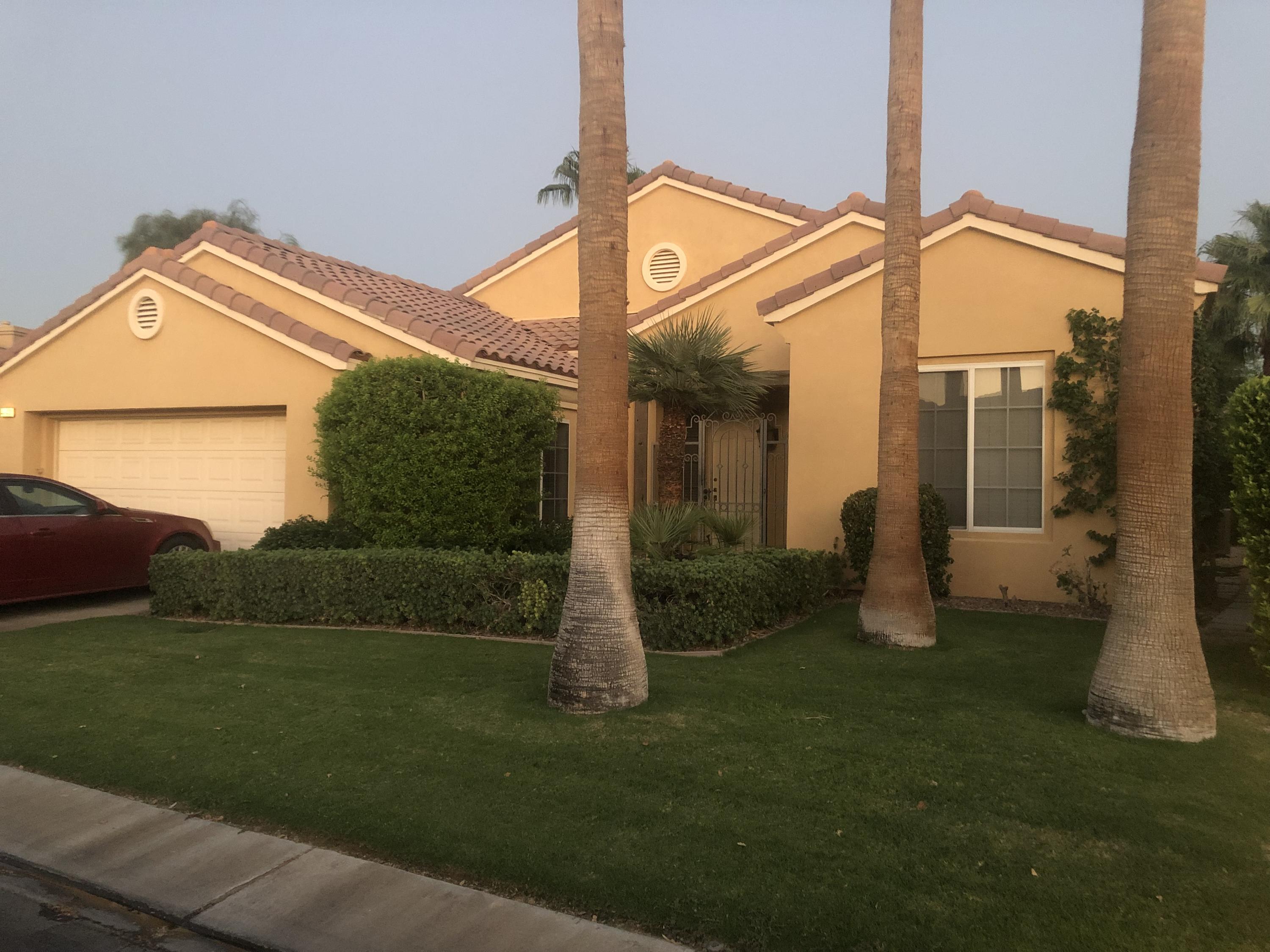 44410 Royal Lytham Drive Indio, CA 92201 - Photo 42 of 72 a front view of a house with garden