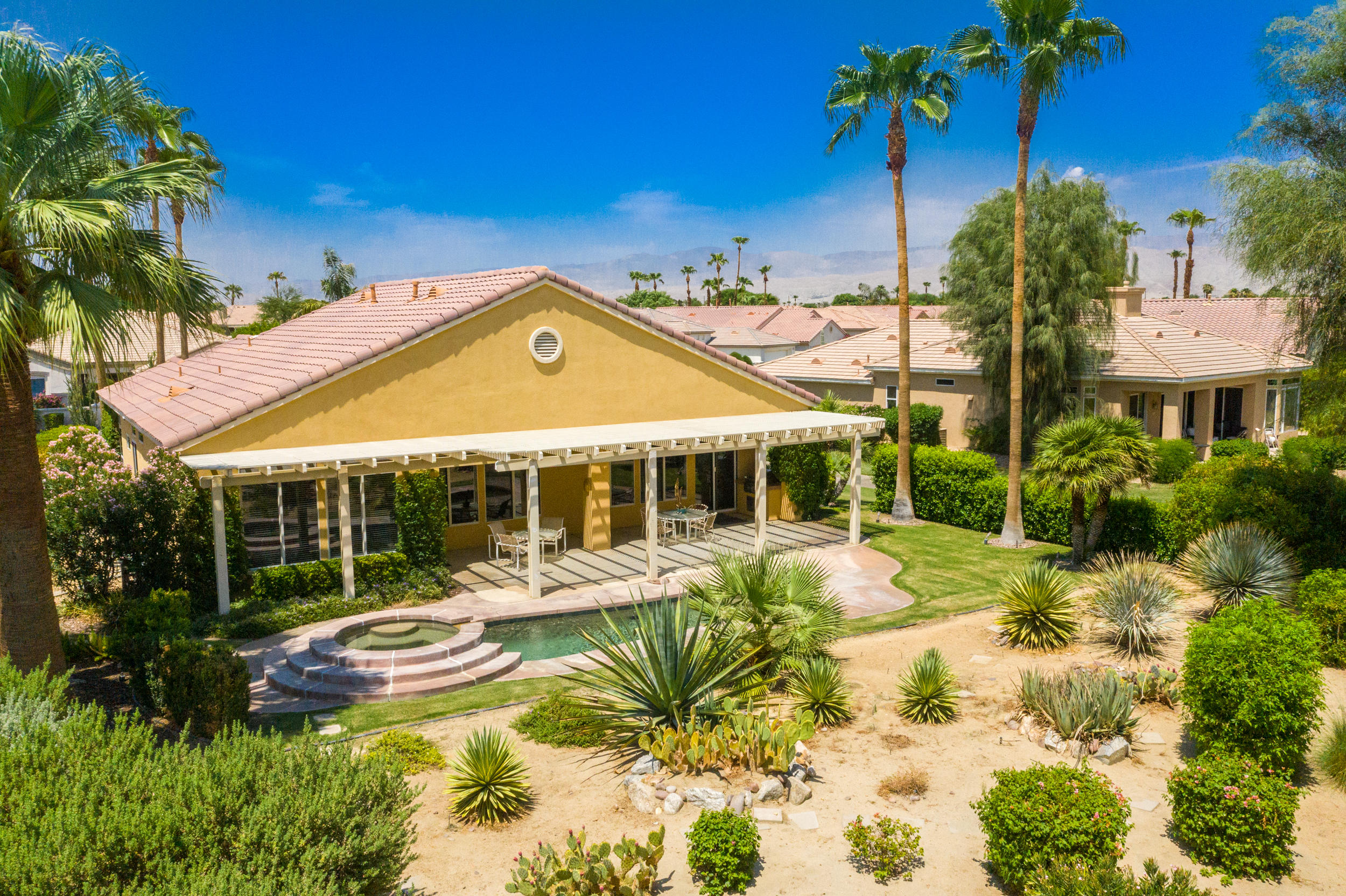 44410 Royal Lytham Drive Indio, CA 92201 - Photo 49 of 72 a view of a house with swimming pool and sitting area
