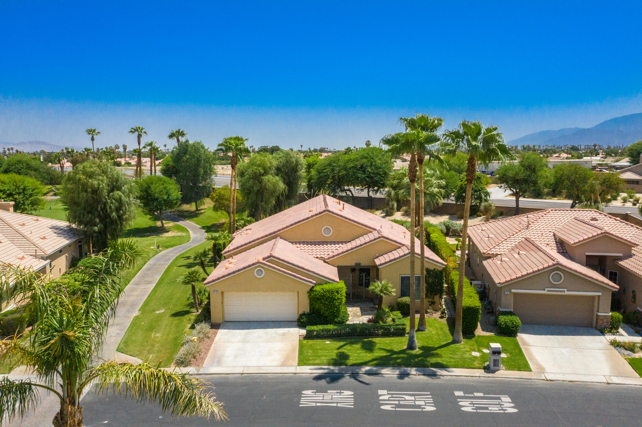 44410 Royal Lytham Drive Indio, CA 92201 - Photo 50 of 72 a aerial view of a house with a yard and large trees