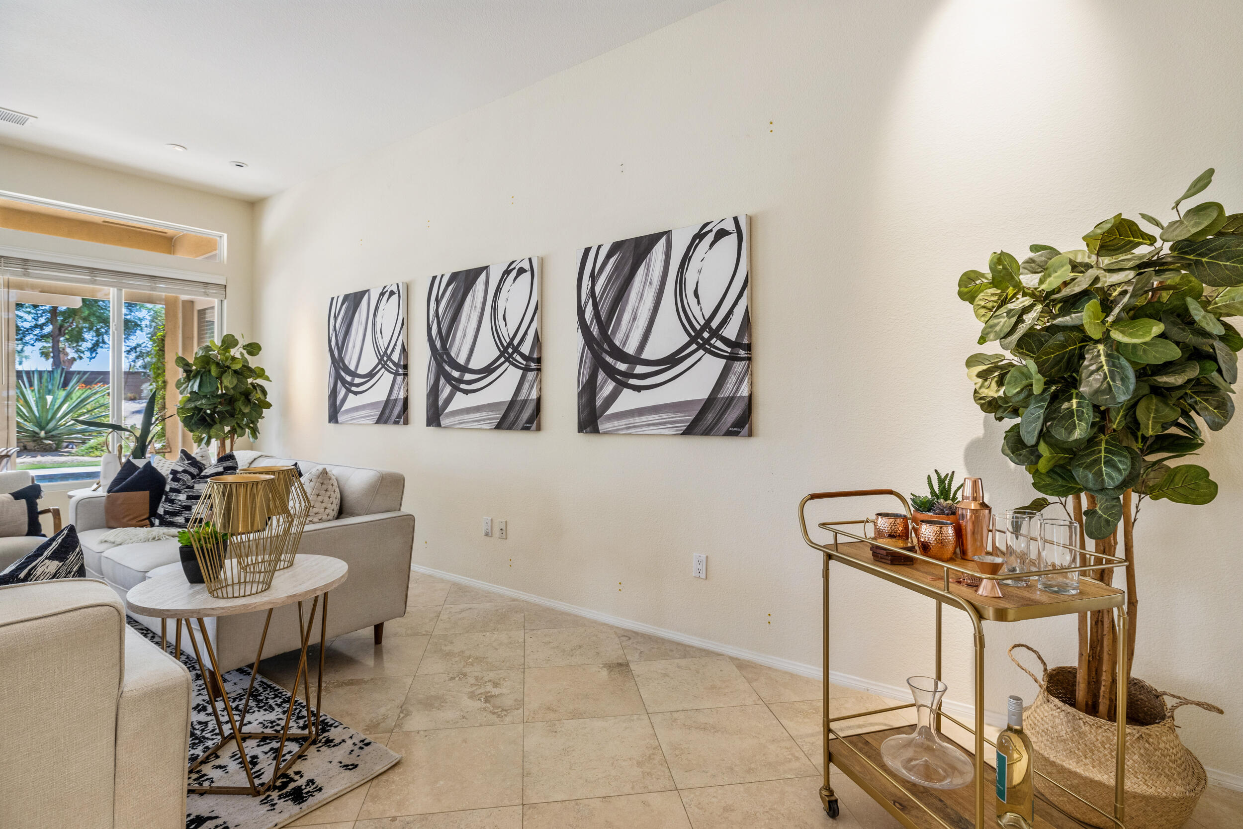 44410 Royal Lytham Drive Indio, CA 92201 - Photo 6 of 72 a living room with furniture and a potted plant