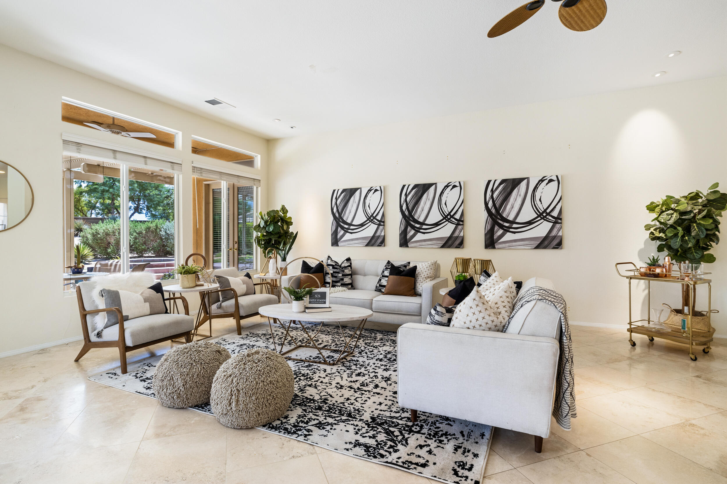 44410 Royal Lytham Drive Indio, CA 92201 - Photo 7 of 72 a living room with furniture and a floor to ceiling window