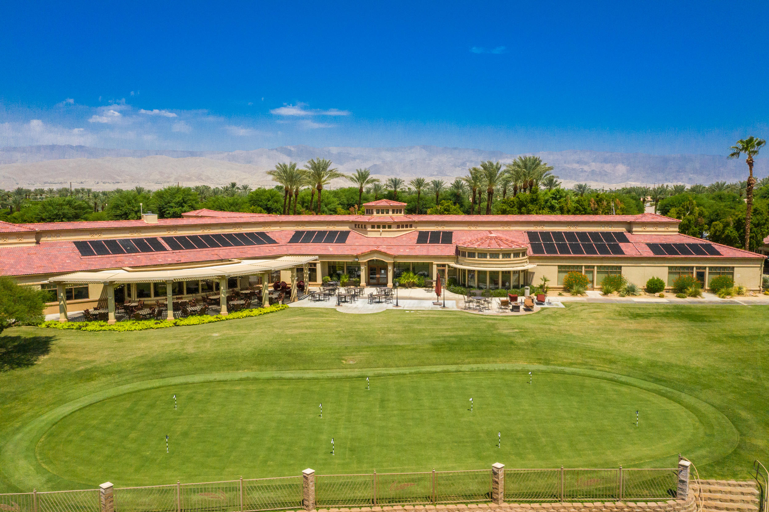 44410 Royal Lytham Drive Indio, CA 92201 - Photo 62 of 72 a view of a swimming pool with lawn chairs and plants