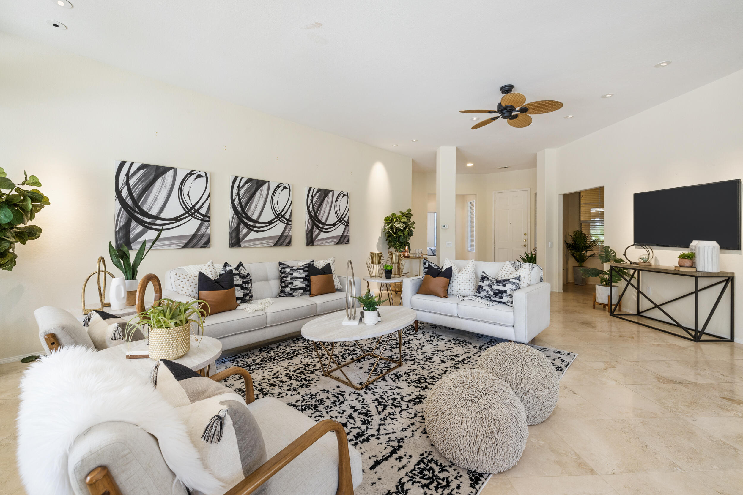 44410 Royal Lytham Drive Indio, CA 92201 - Photo 8 of 72 a living room with furniture and a flat screen tv