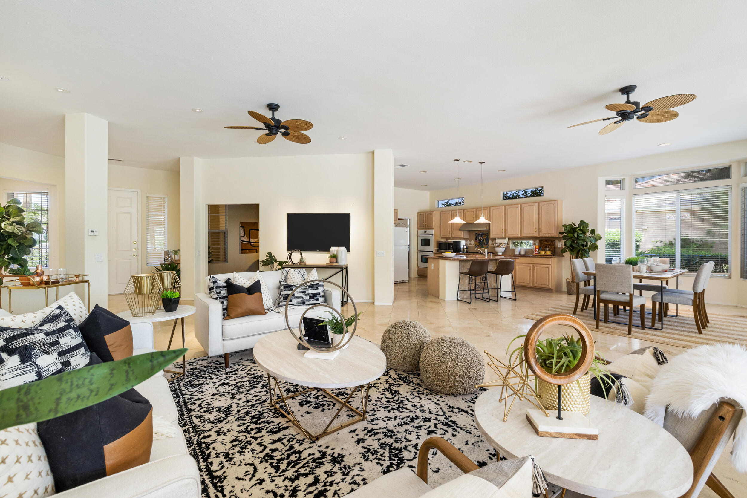 44410 Royal Lytham Drive Indio, CA 92201 - Photo 10 of 72 a living room with furniture a rug and a flat screen tv
