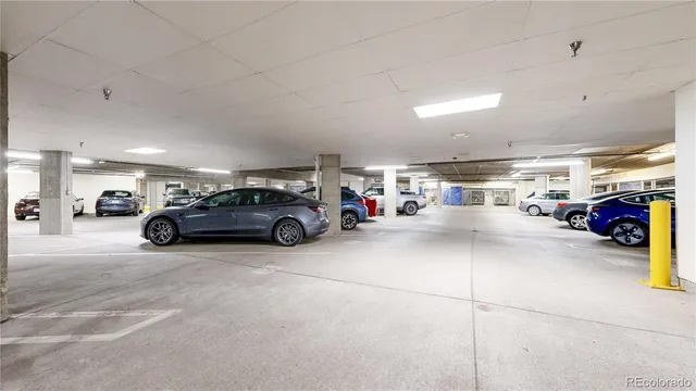 a view of parking with cars parked