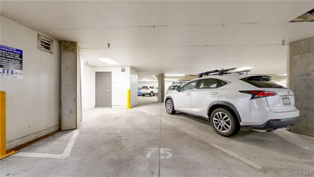 a view of a car garage bed and a car parked in a kitchen