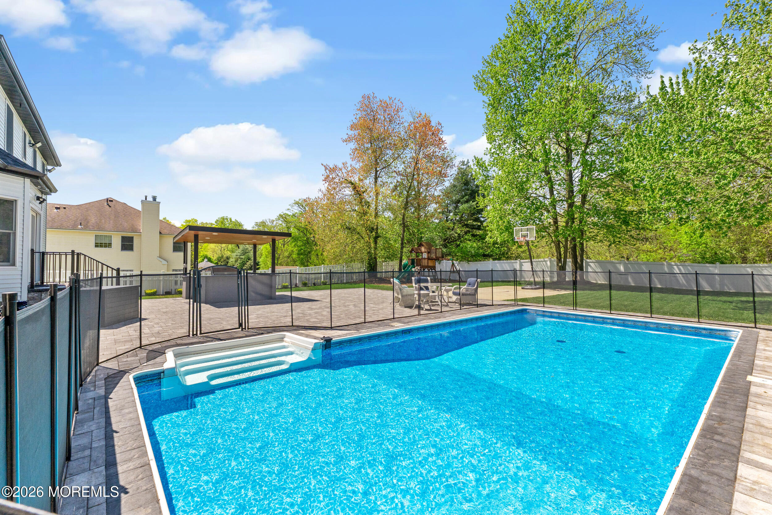104 Autumn Road Matawan, NJ 07747 - Photo 51 of 64 a view of swimming pool with seating