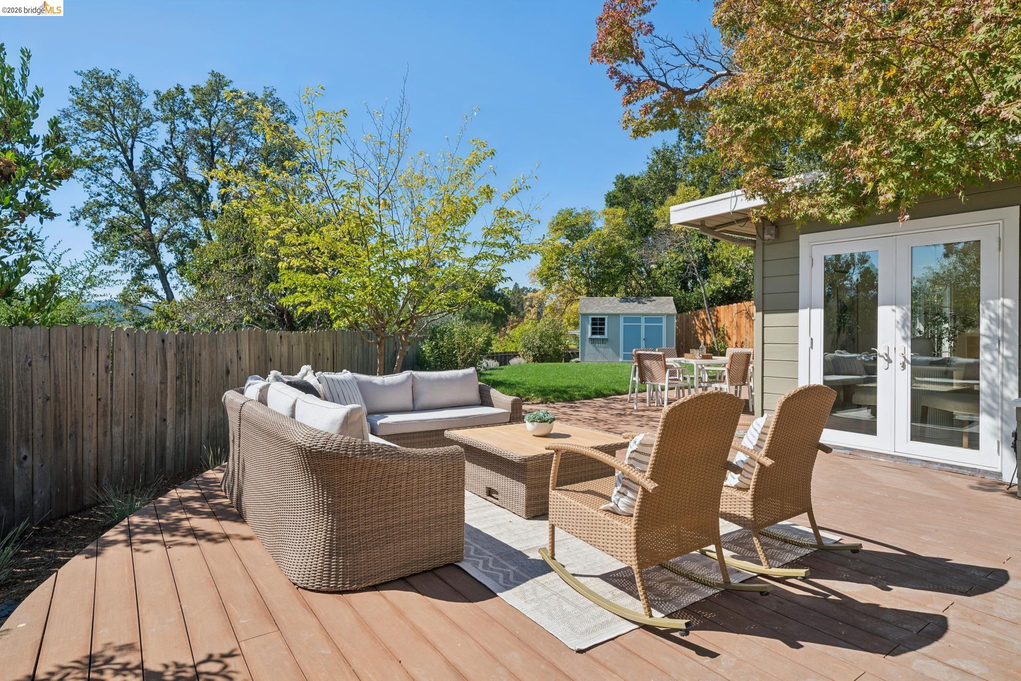 1321 Sunset Loop Lafayette, CA 94549 - Photo 39 of 49 Expansive wood deck with a privacy fence, complemented by an outdoor patio and manicured lawn