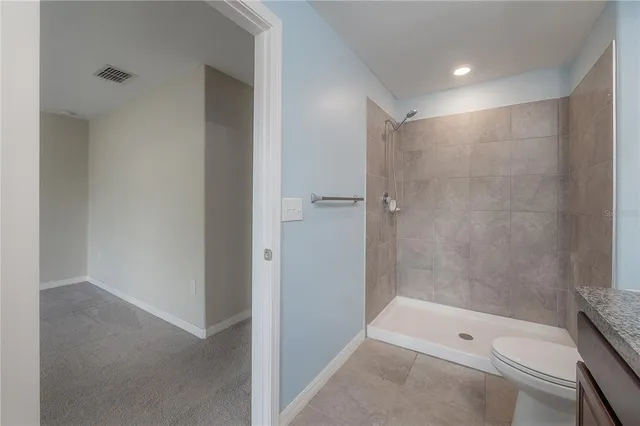 a view of a bathroom with a glass door