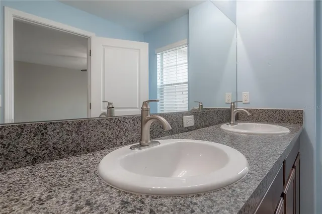 a bathroom with a shower and a bath tub