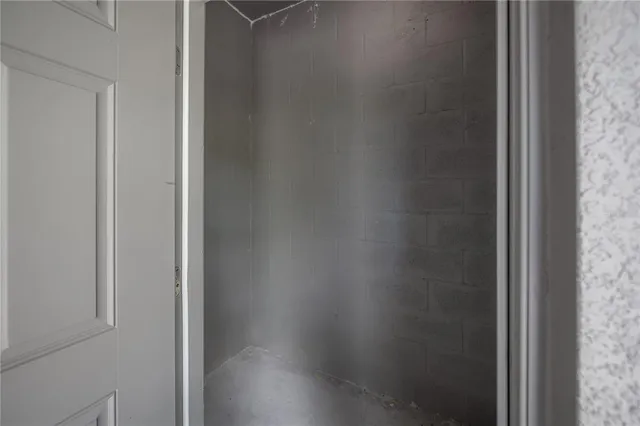 a backyard of a house with potted plants