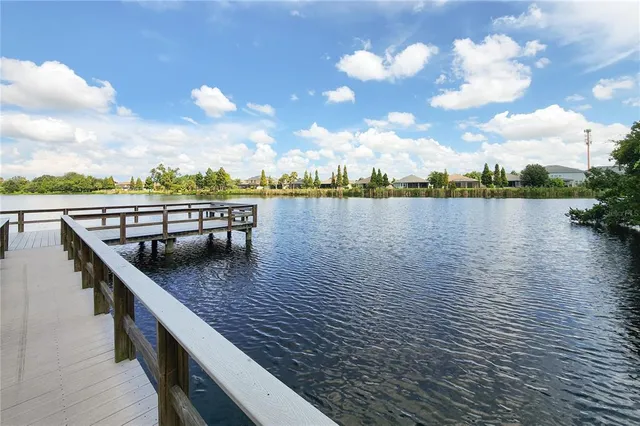 a view of a wooden house with a tree