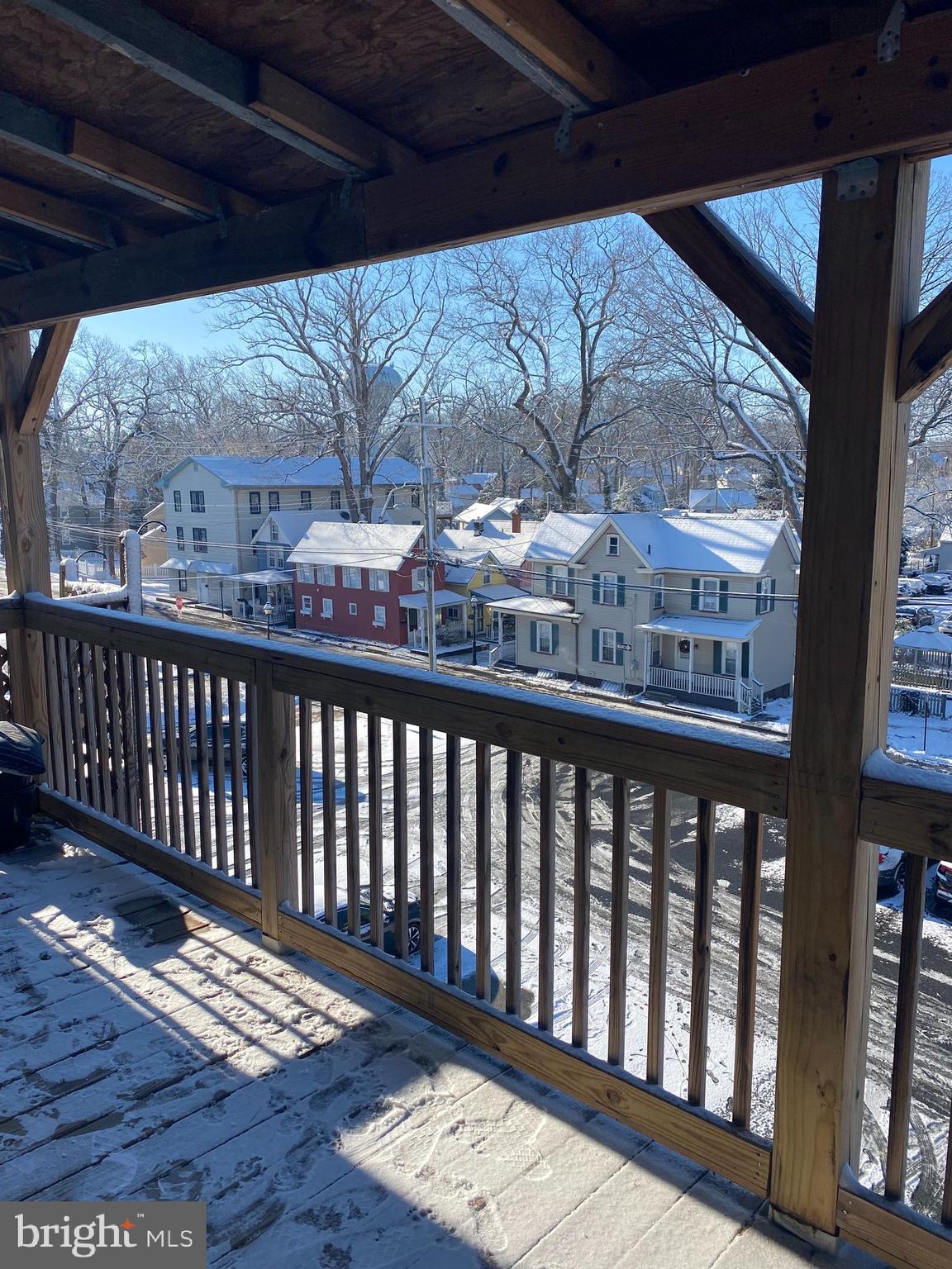 58 South Broadway, Unit 58C Pitman, NJ 08071 - Photo 16 of 35 a view of a porch with wooden floor