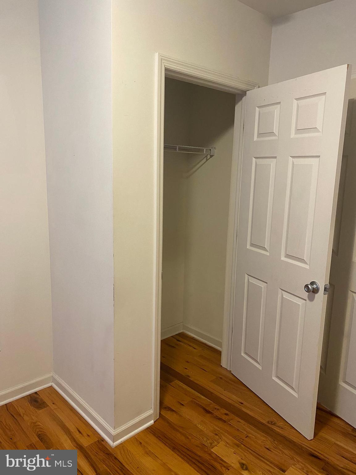 58 South Broadway, Unit 58C Pitman, NJ 08071 - Photo 30 of 35 an empty room with wooden floor