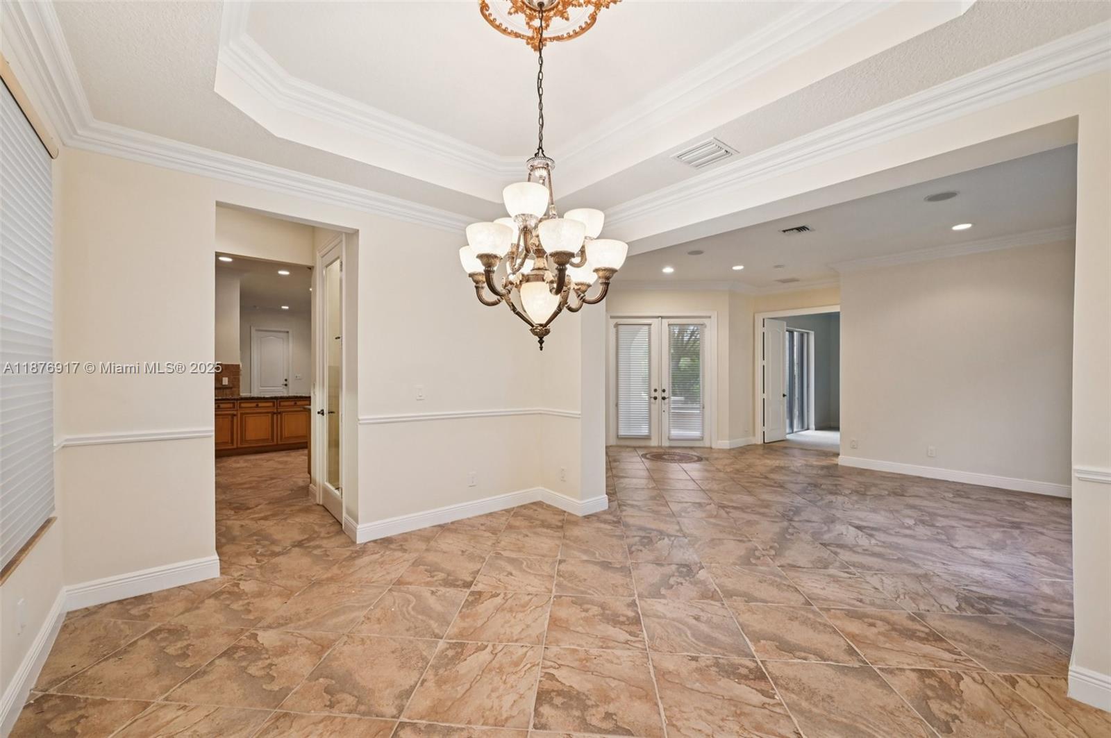 9192 Nugent Trail West Palm Beach, FL 33411 - Photo 12 of 62 a view of a hallway with a chandelier