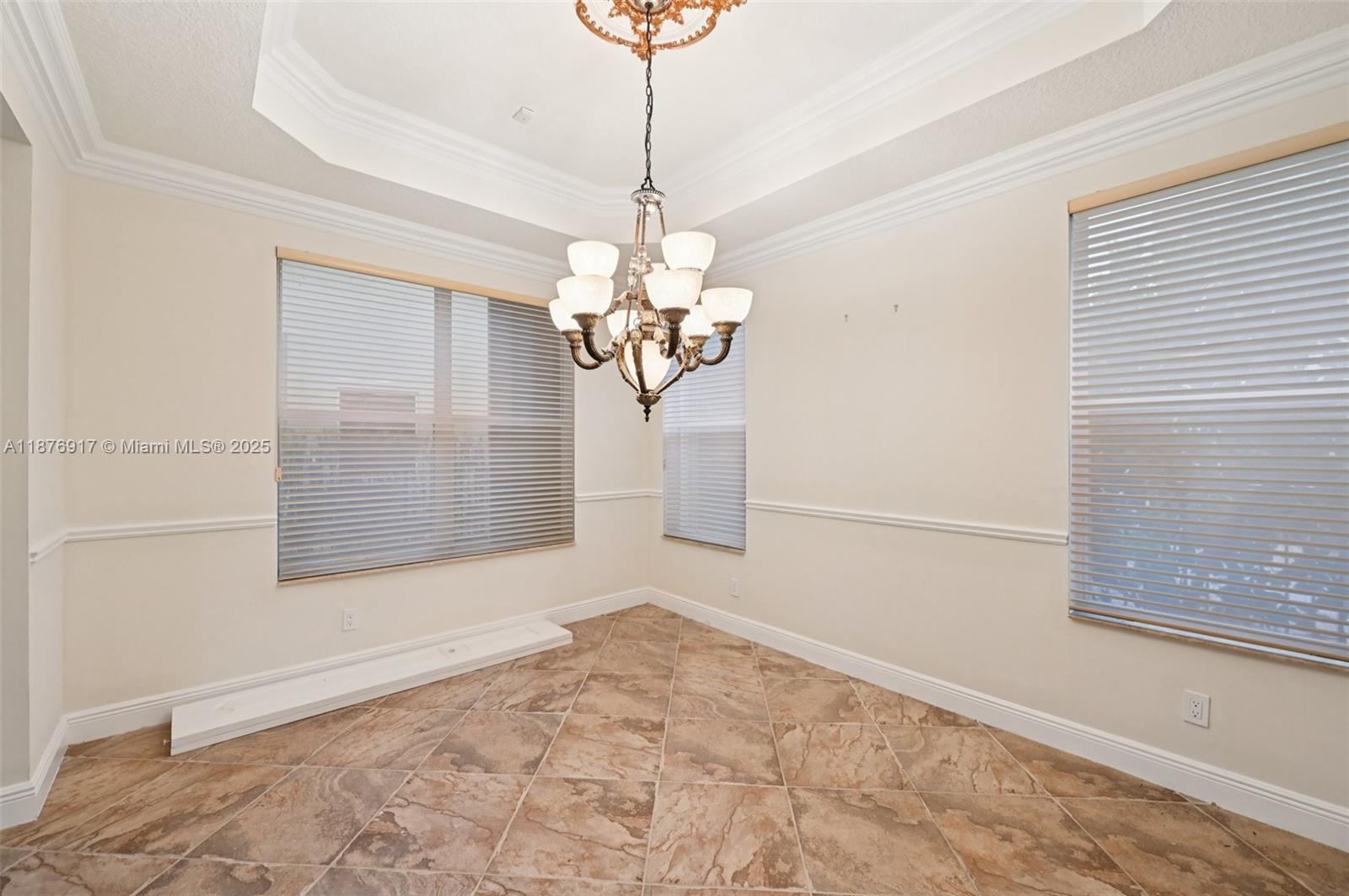 9192 Nugent Trail West Palm Beach, FL 33411 - Photo 14 of 62 a view of a room with a window and a chandelier