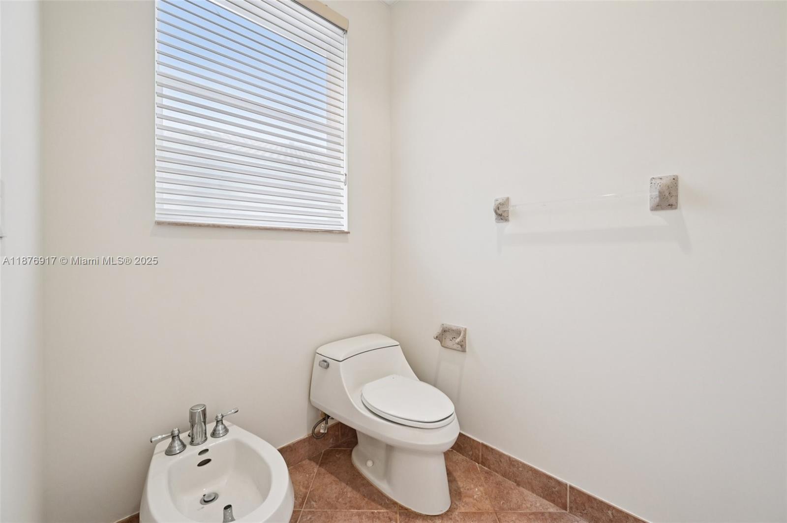 9192 Nugent Trail West Palm Beach, FL 33411 - Photo 36 of 62 a white toilet sitting next to a white sink