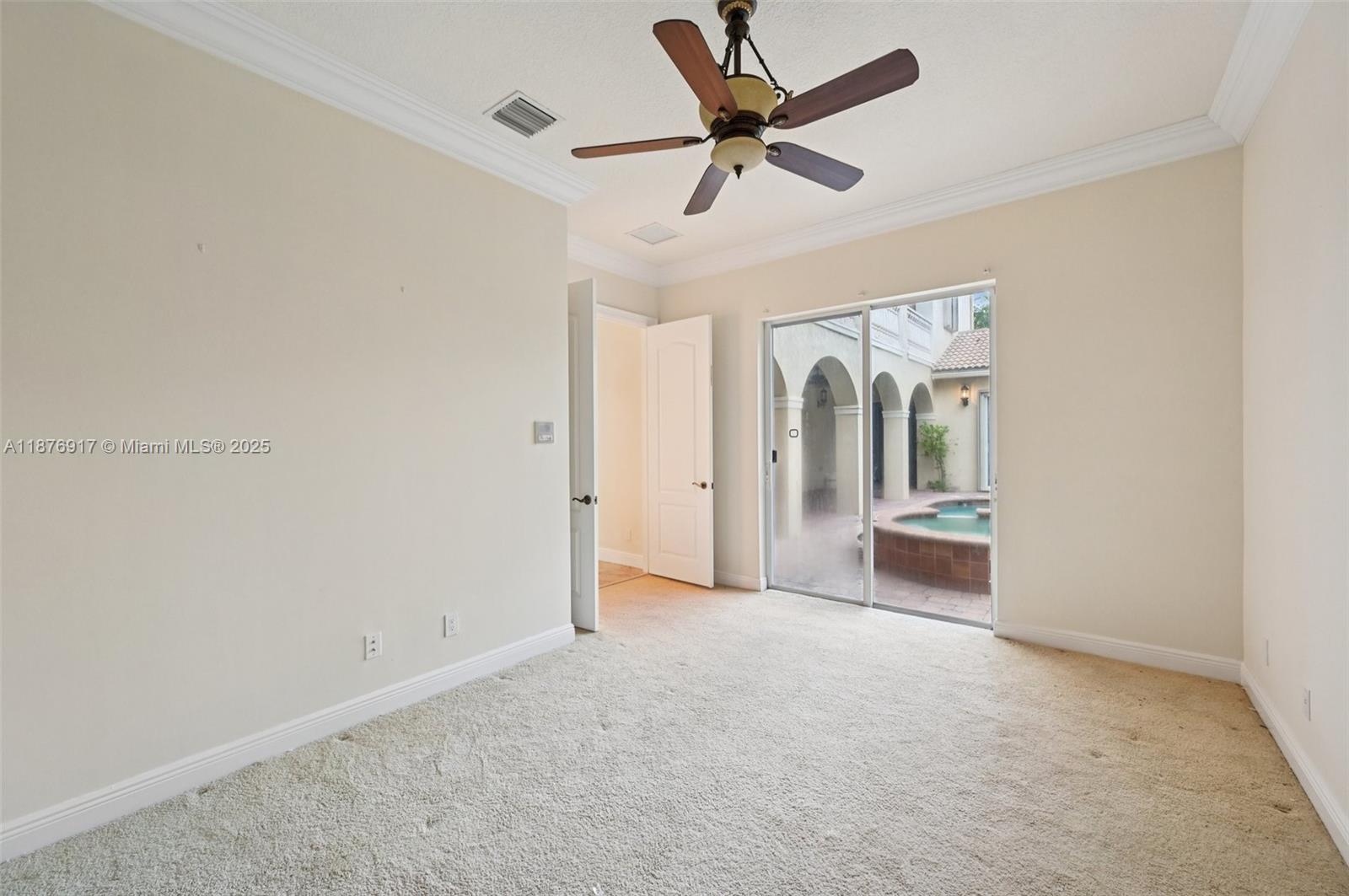 9192 Nugent Trail West Palm Beach, FL 33411 - Photo 40 of 62 an empty room with a ceiling fan and a window