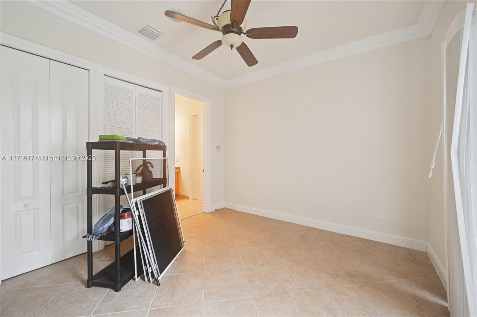 9192 Nugent Trail West Palm Beach, FL 33411 - Photo 42 of 62 a room with gym equipment and white walls