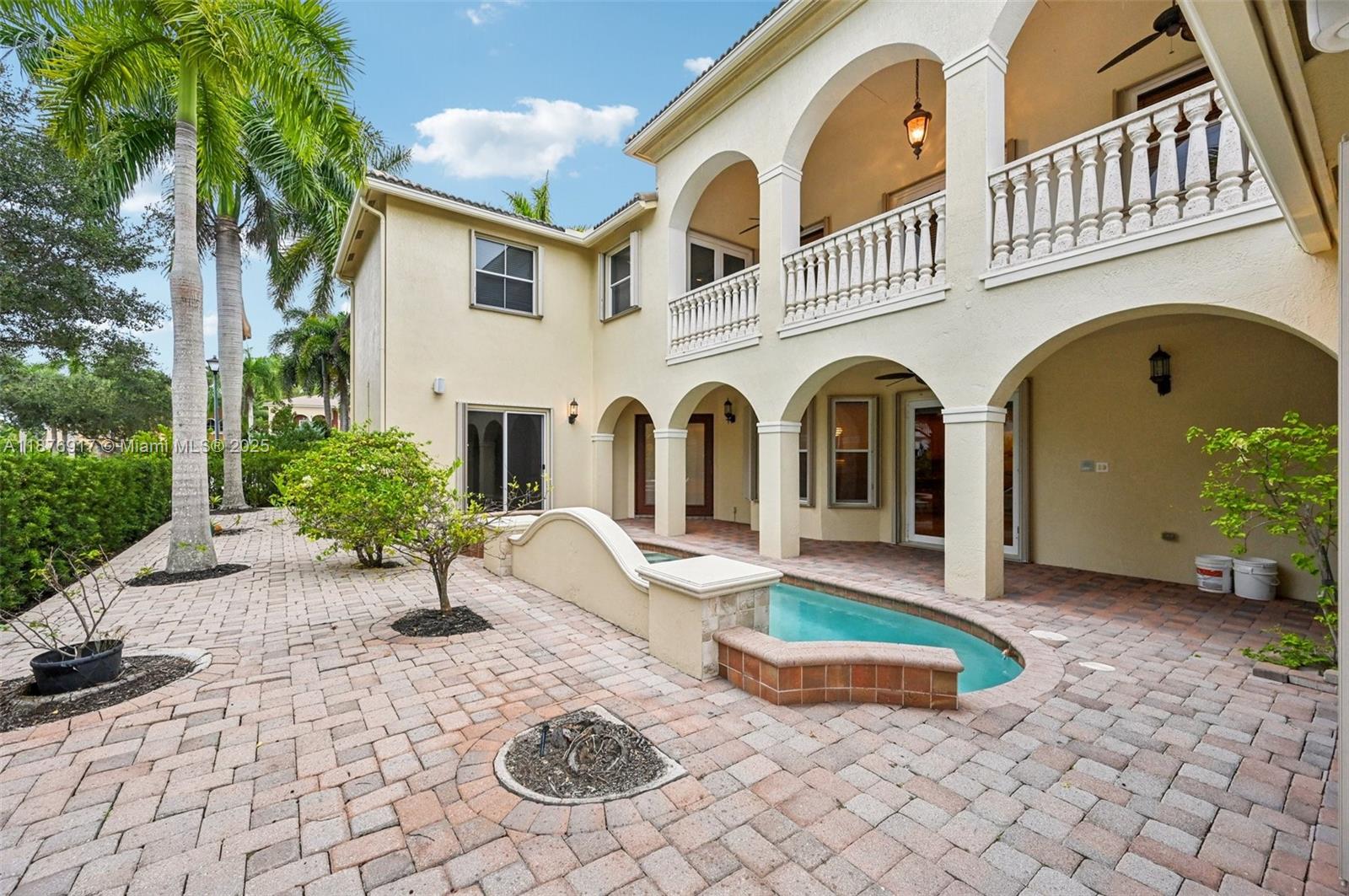 9192 Nugent Trail West Palm Beach, FL 33411 - Photo 46 of 62 a front view of a house with garden