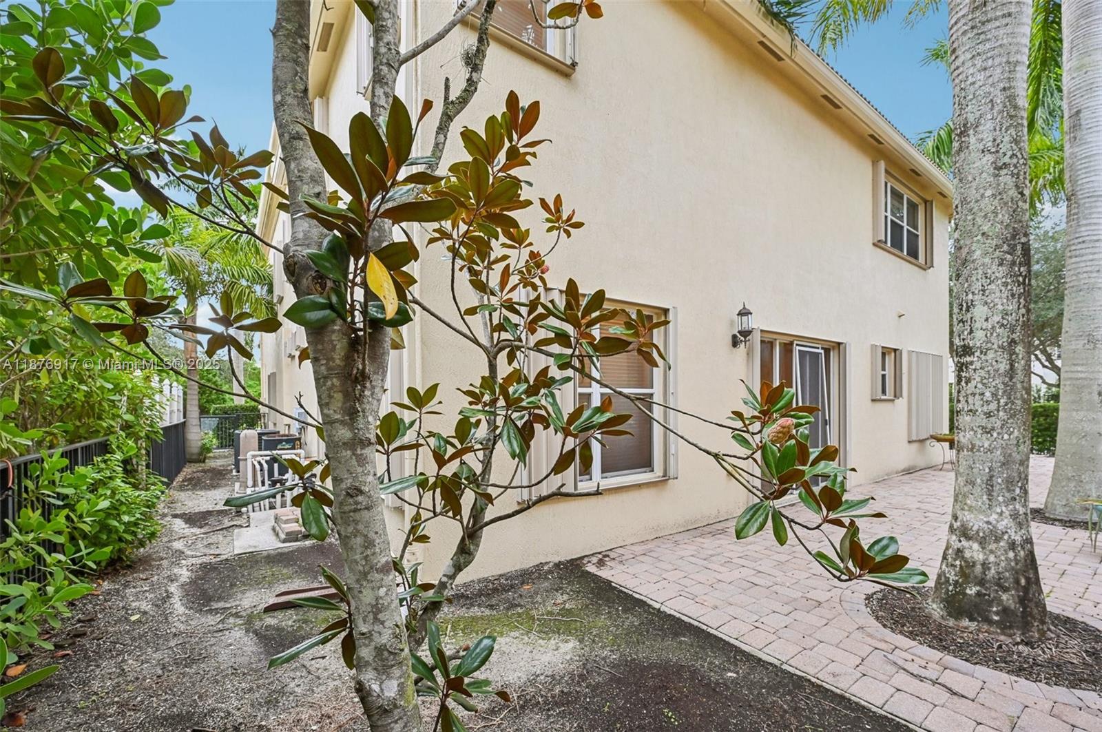 9192 Nugent Trail West Palm Beach, FL 33411 - Photo 50 of 62 a plant in a yard with potted plants