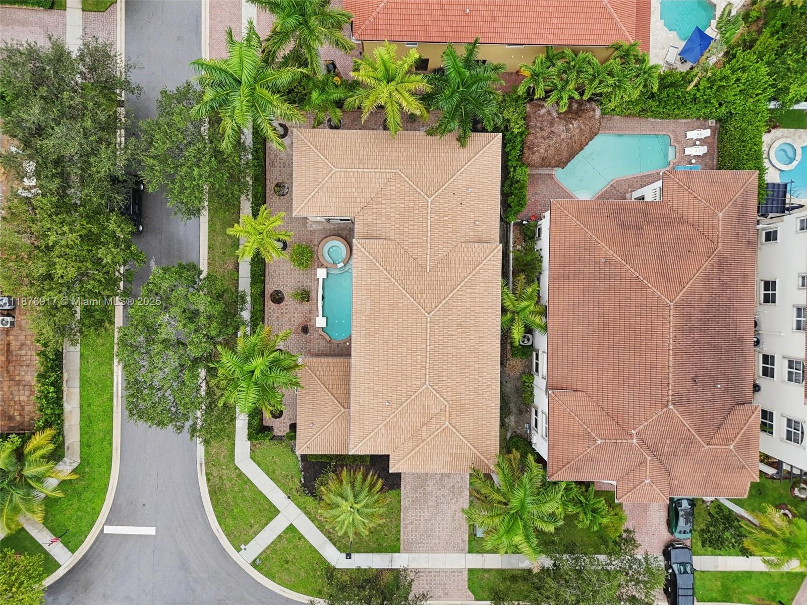 9192 Nugent Trail West Palm Beach, FL 33411 - Photo 56 of 62 an aerial view of a house with a yard and potted plants
