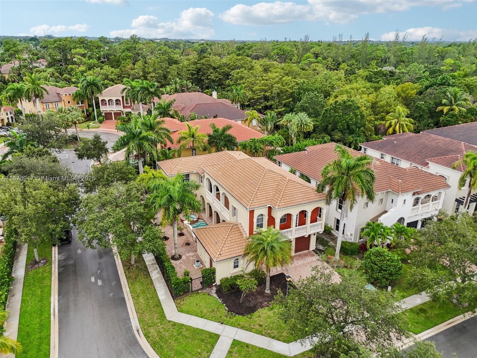 9192 Nugent Trail West Palm Beach, FL 33411 - Photo 57 of 62 an aerial view of multiple houses with yard