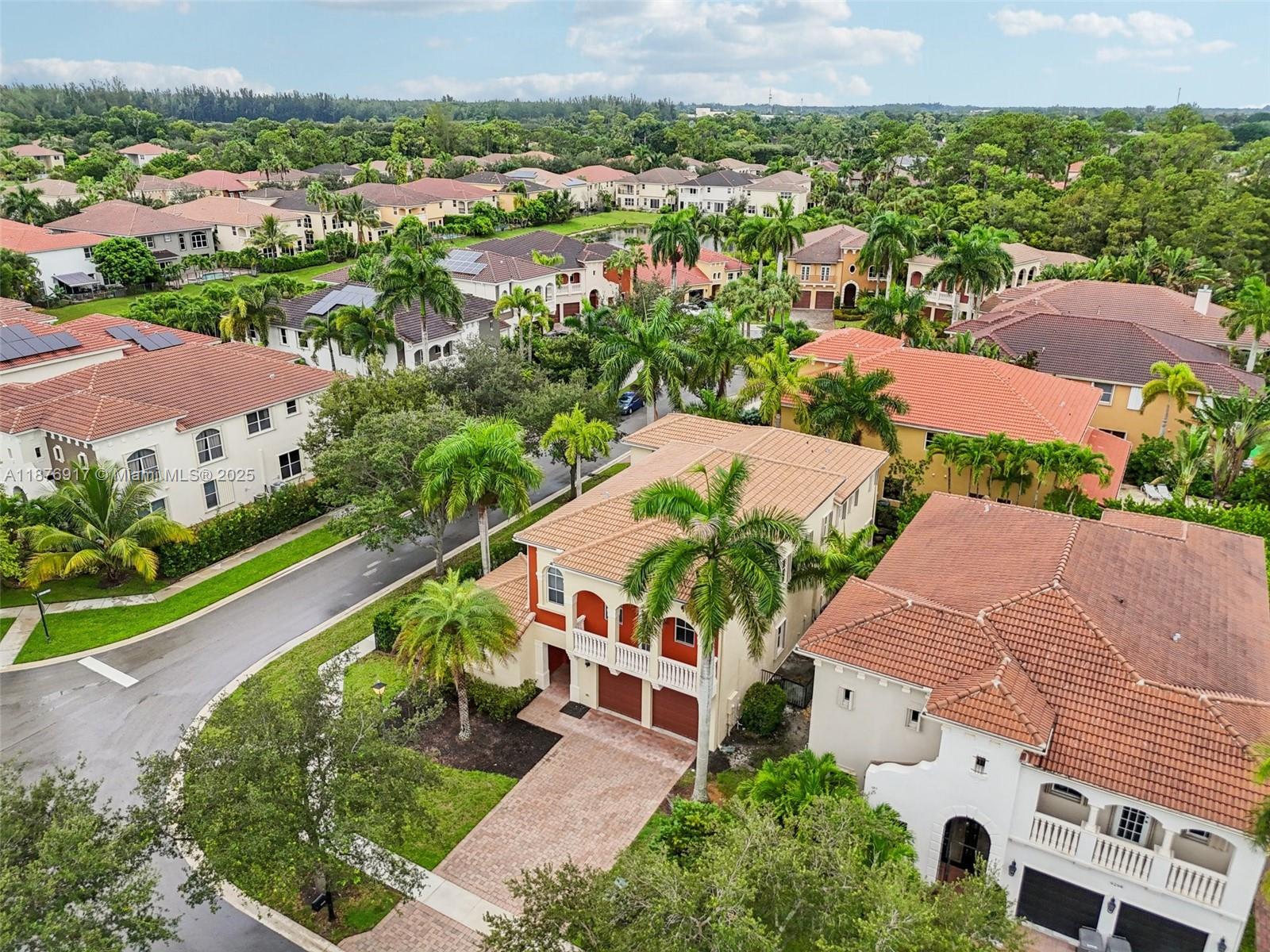 9192 Nugent Trail West Palm Beach, FL 33411 - Photo 58 of 62 an aerial view of multiple houses with yard