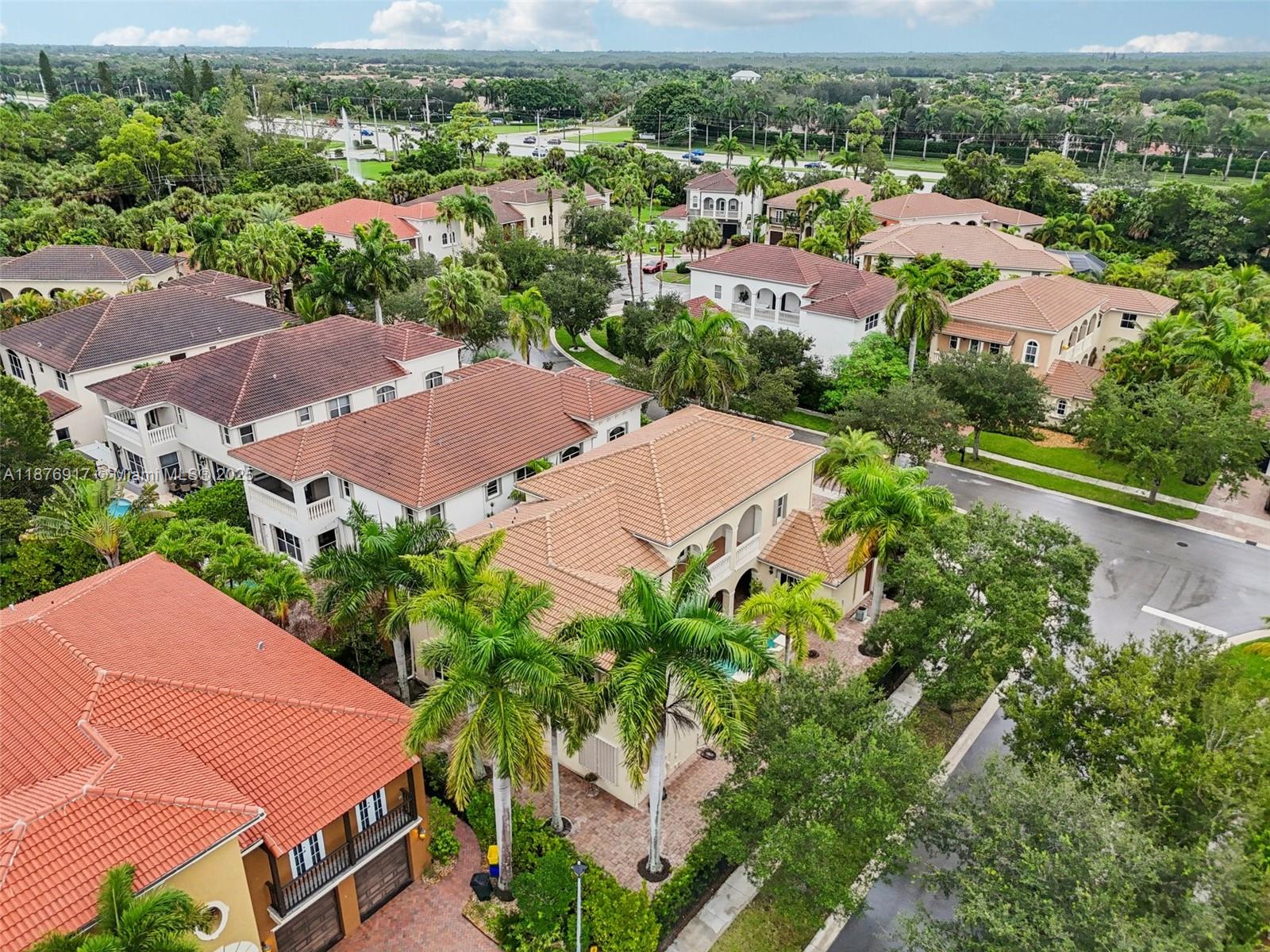 9192 Nugent Trail West Palm Beach, FL 33411 - Photo 59 of 62 an aerial view of multiple houses with yard