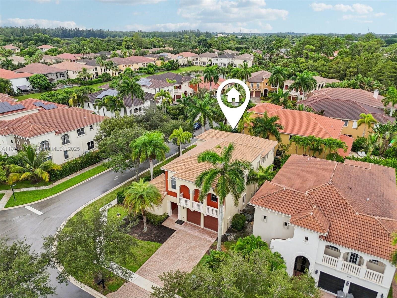 9192 Nugent Trail West Palm Beach, FL 33411 - Photo 60 of 62 an aerial view of multiple house with a yard