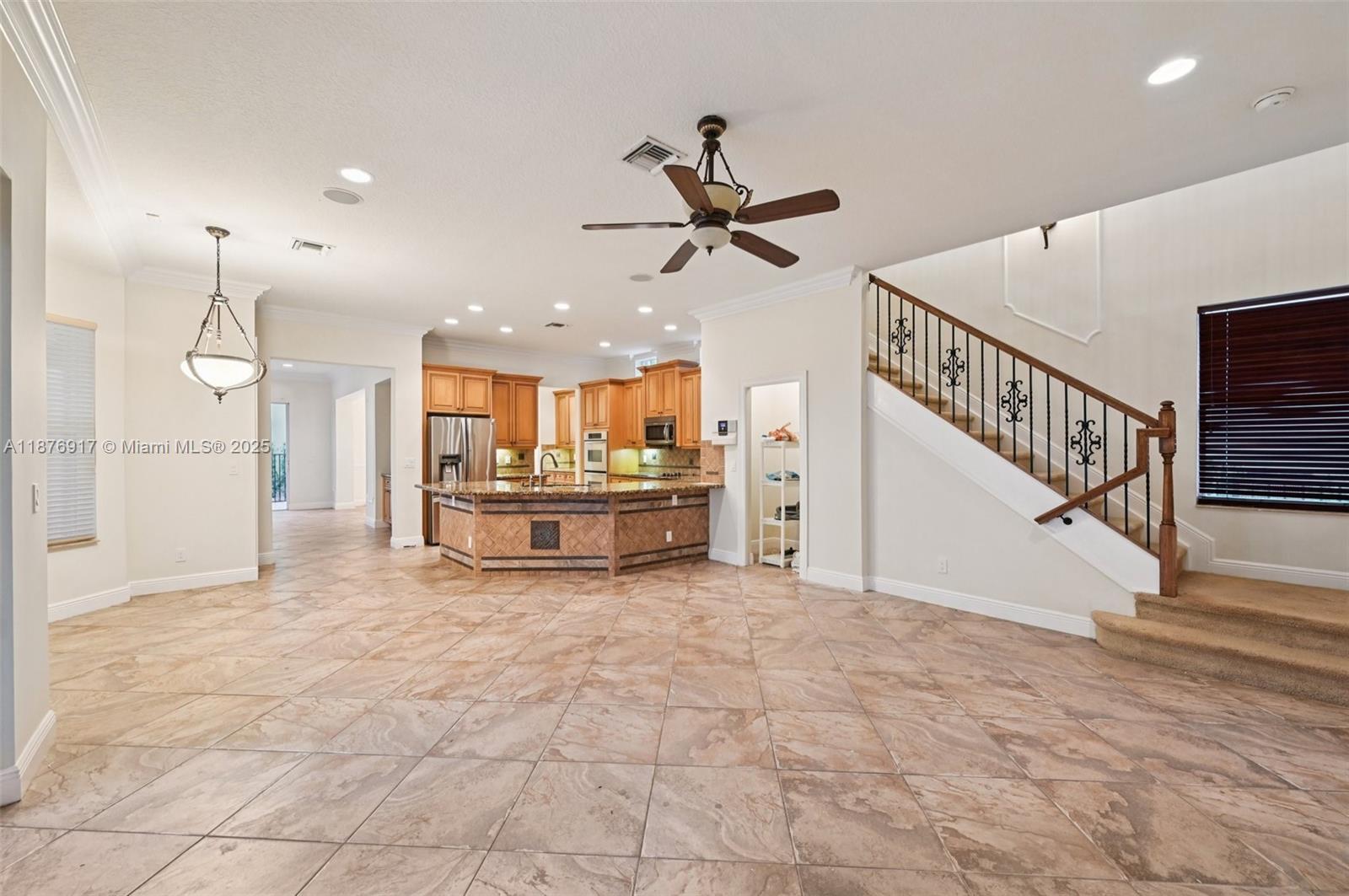 9192 Nugent Trail West Palm Beach, FL 33411 - Photo 6 of 62 a view of a livingroom with a ceiling fan
