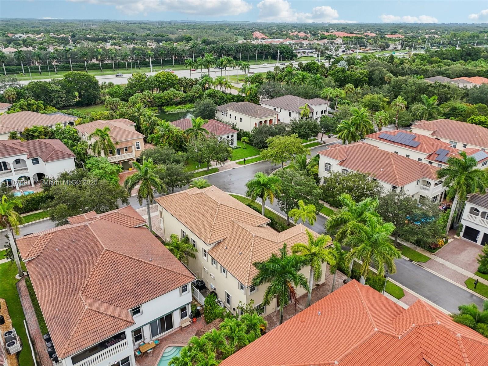 9192 Nugent Trail West Palm Beach, FL 33411 - Photo 61 of 62 an aerial view of residential houses with outdoor space and street view