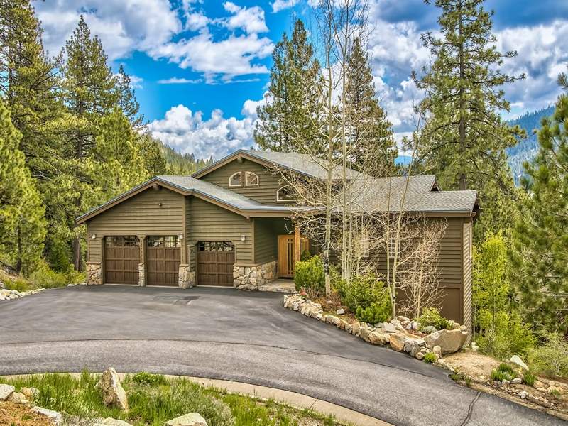 front view of a house with a garden