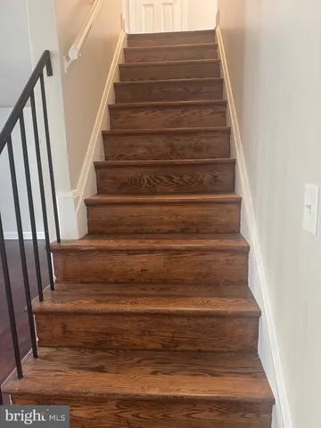 a white toilet sitting next to a white sink