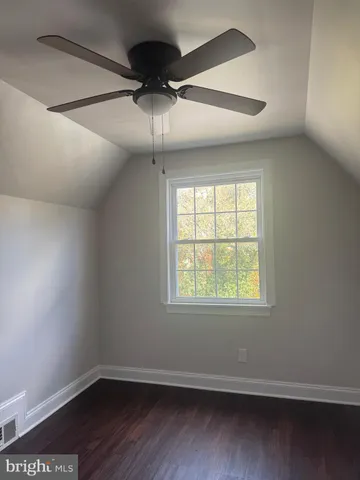 an empty room that has a window in it