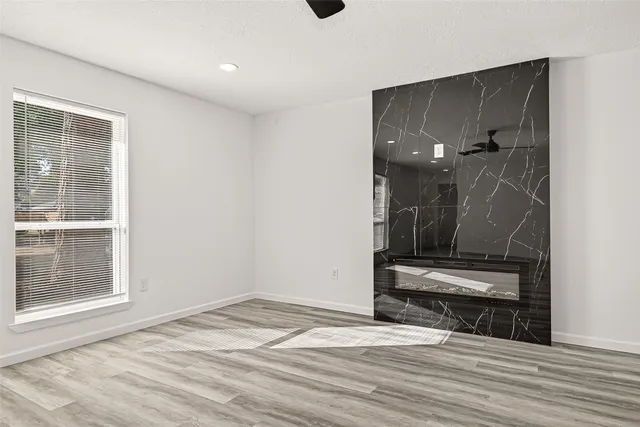 a view of a kitchen with wooden floor and a sink