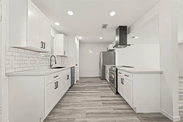 a bathroom with a shower a toilet and a sink