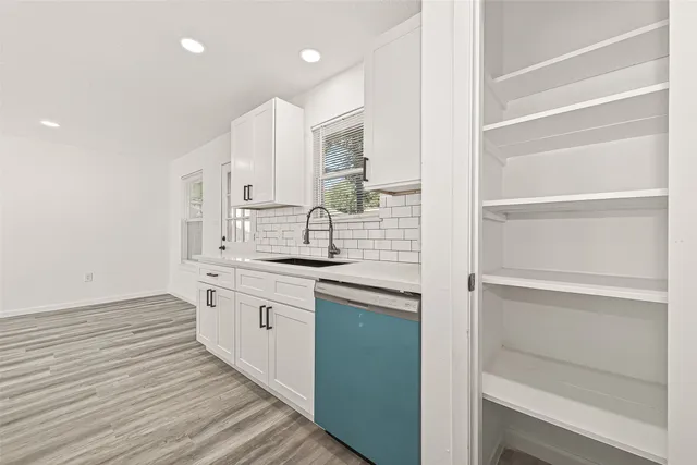 a bathroom with a granite countertop sink a toilet and a mirror