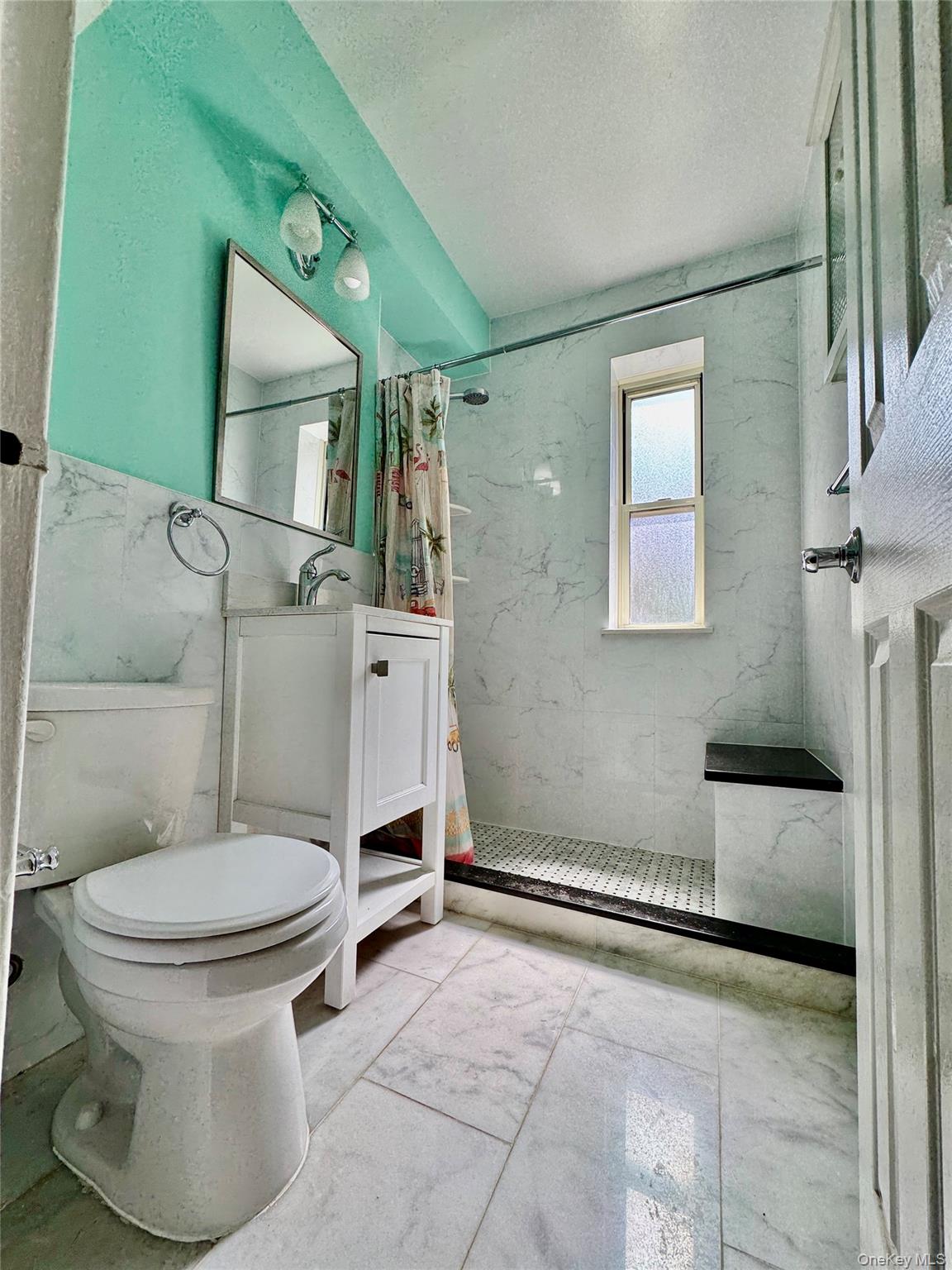 113-14 72nd Road, Unit 1M Queens, NY 11375 - Photo 15 of 20 a bathroom with a toilet and a shower