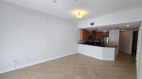 a view of a kitchen with a sink and cabinets