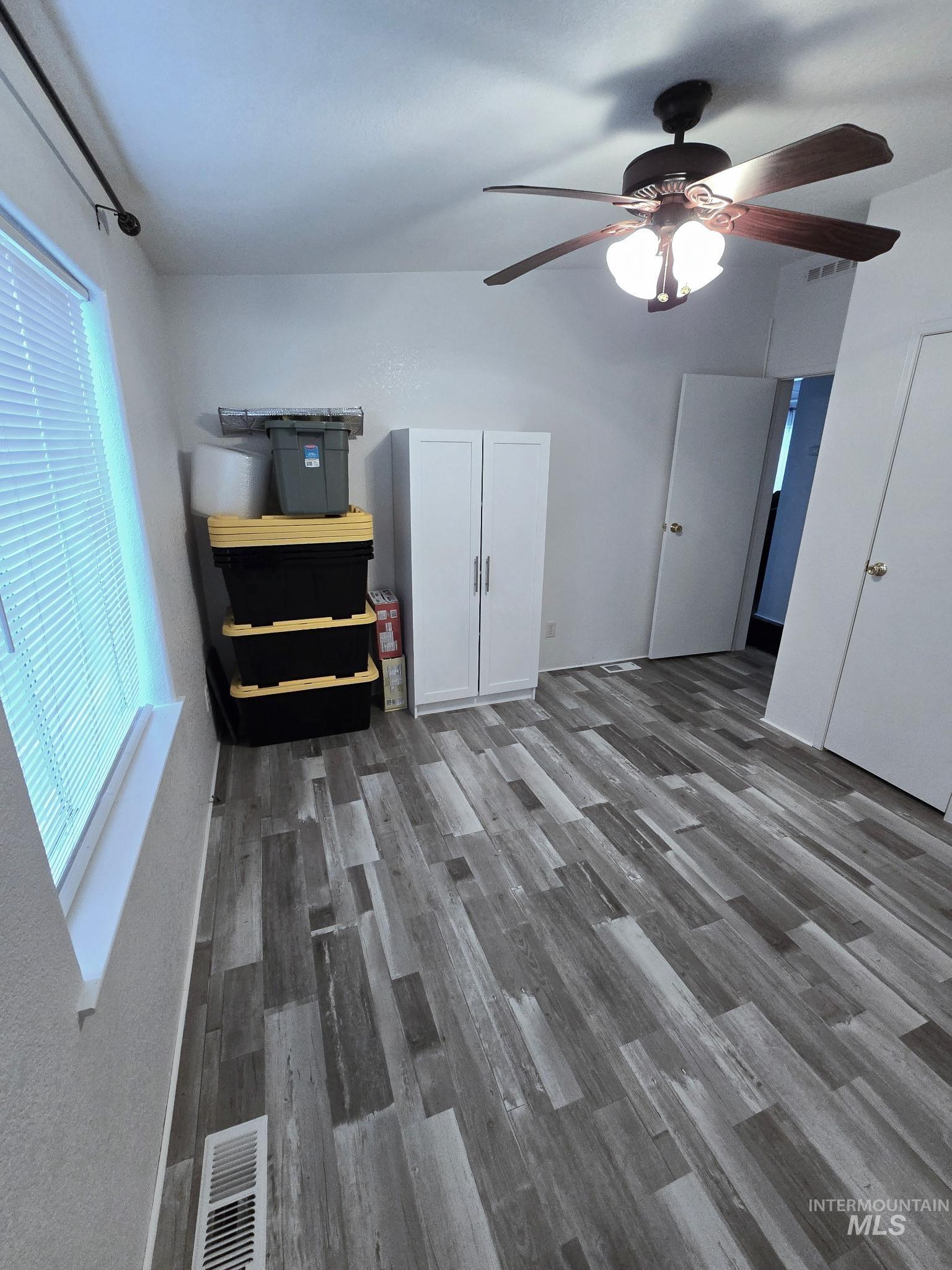 2115 6th Avenue, Unit 51 Clarkston, WA 99403 - Photo 18 of 34 Living area with a ceiling fan and dark wood finished floors