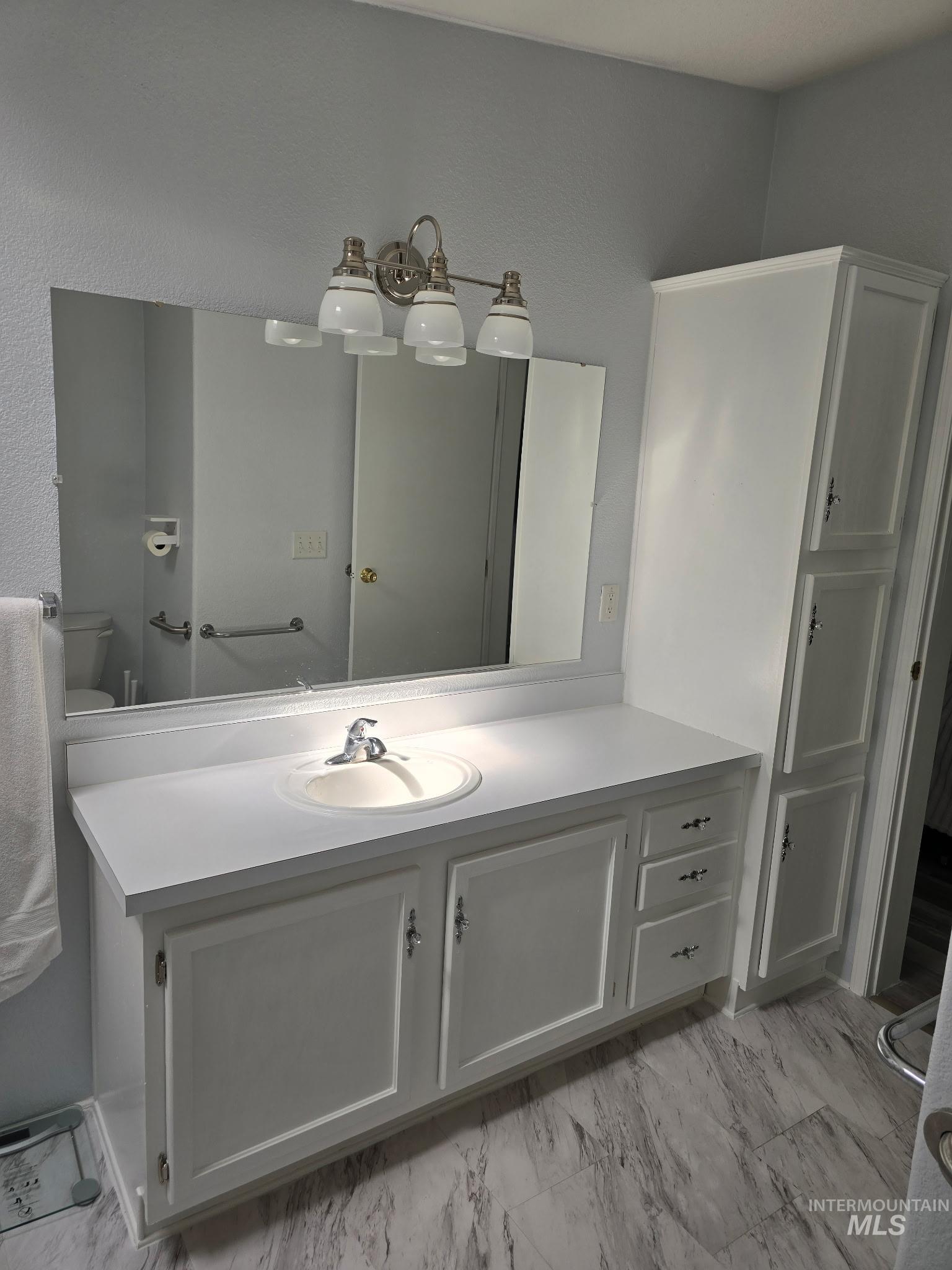 2115 6th Avenue, Unit 51 Clarkston, WA 99403 - Photo 19 of 34 Bathroom with vanity and light marble finish flooring