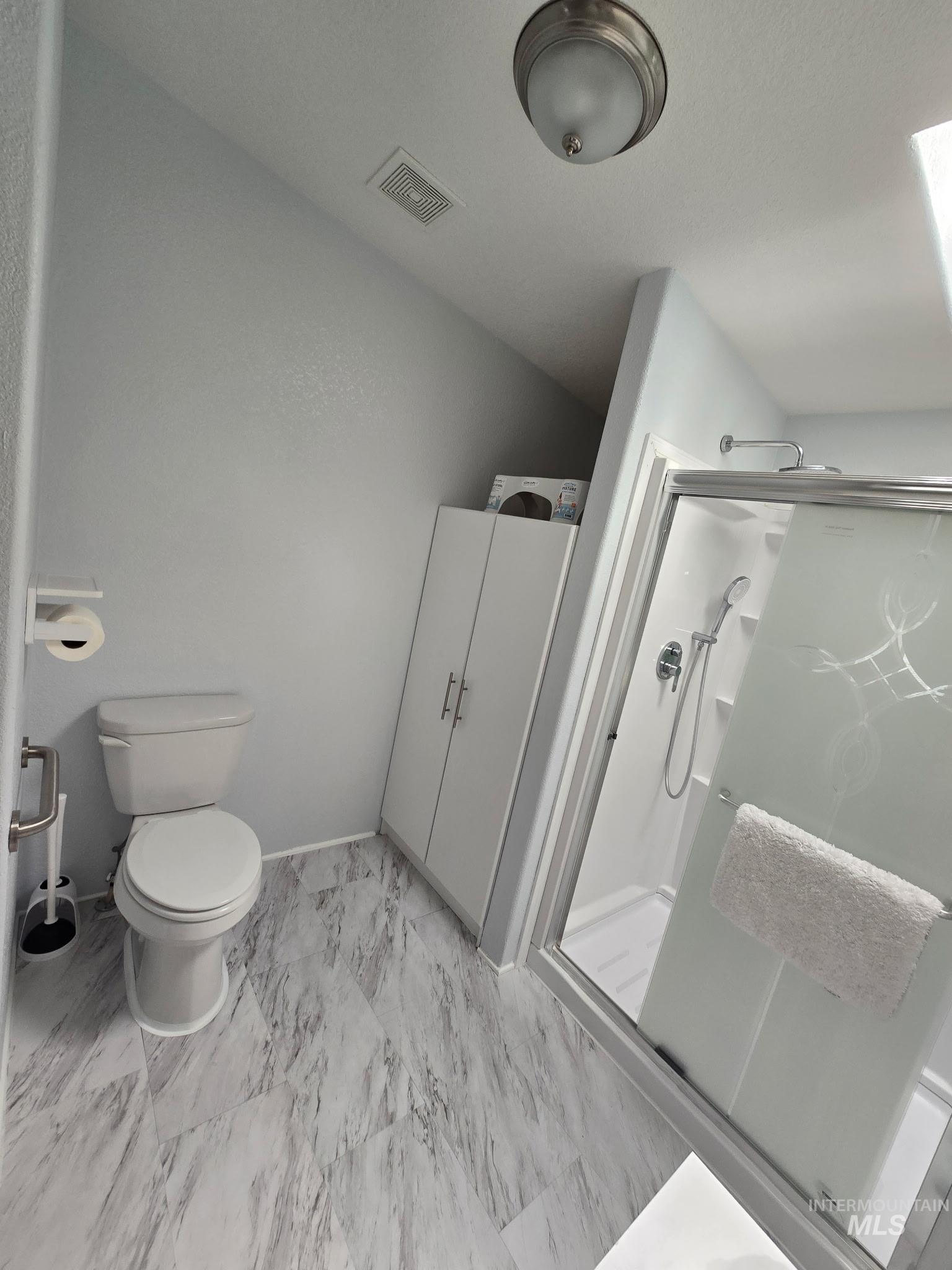 2115 6th Avenue, Unit 51 Clarkston, WA 99403 - Photo 21 of 34 Bathroom with a shower stall and light marble finish floors