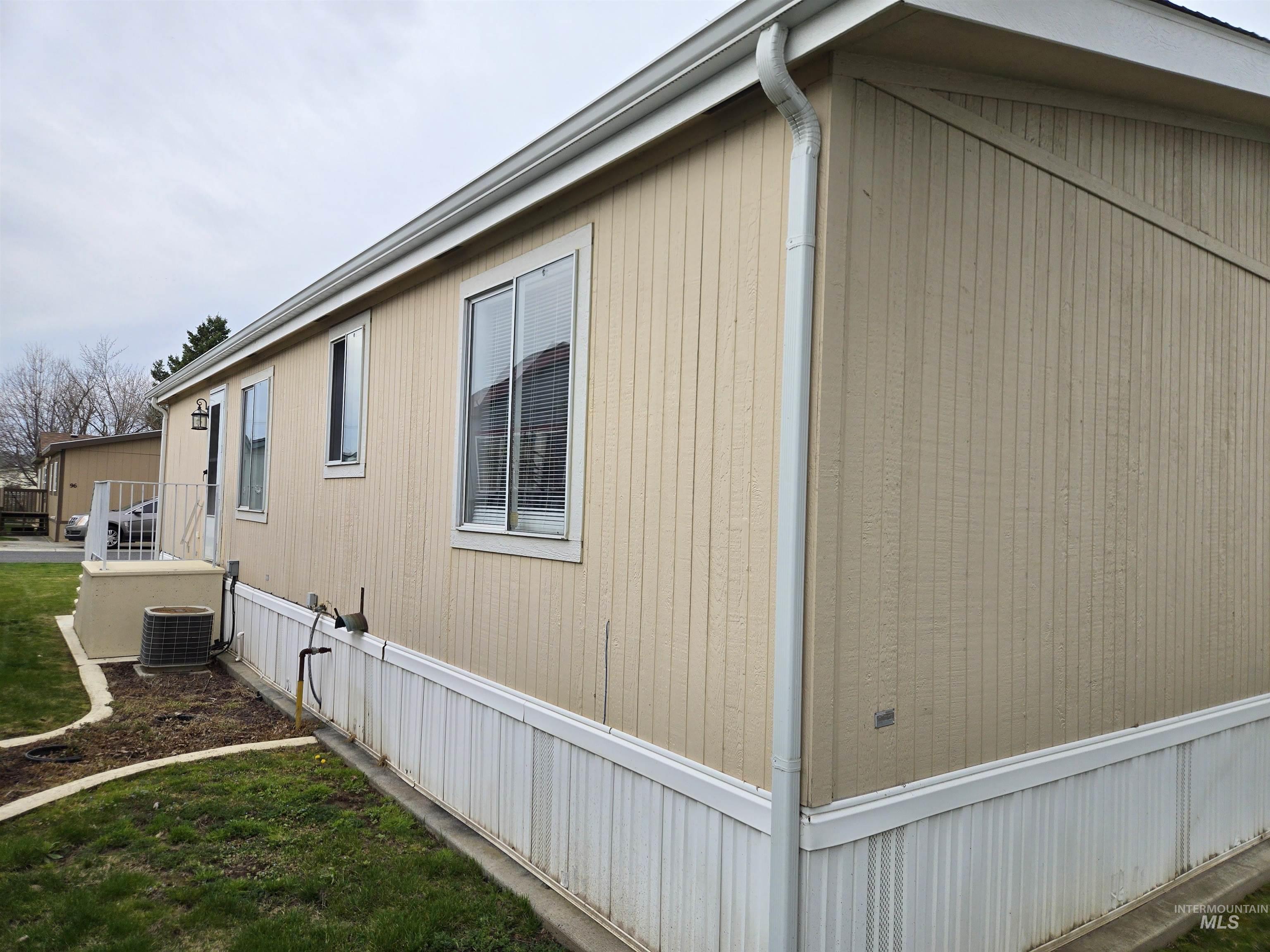 2115 6th Avenue, Unit 51 Clarkston, WA 99403 - Photo 29 of 34 View of property exterior with a central AC unit