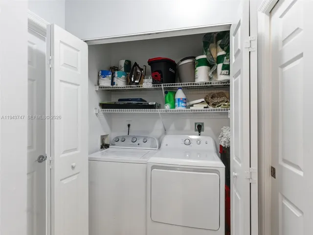 an aerial view of residential houses with outdoor space and swimming pool