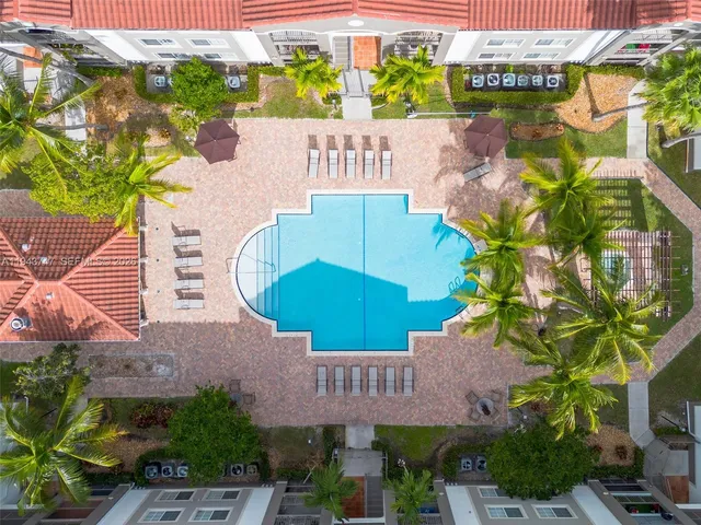 an aerial view of a house with garden