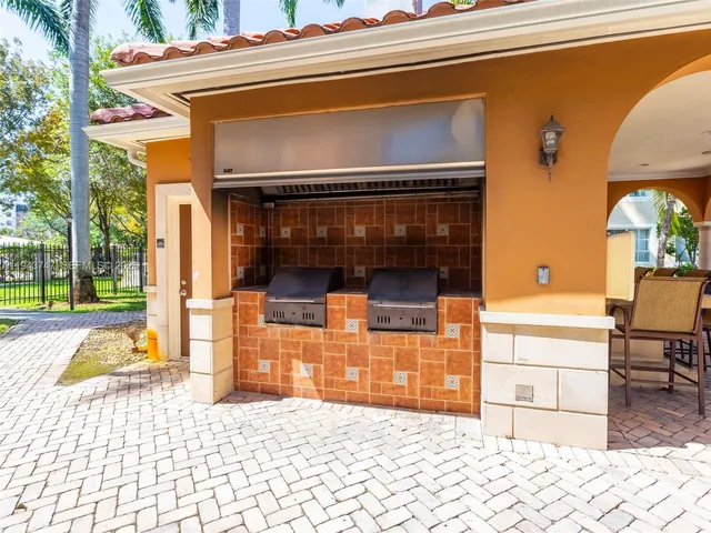 a living room filled with furniture and chandelier